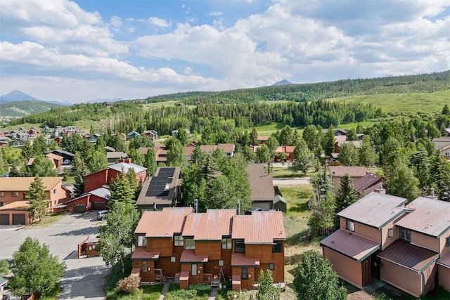 329 N Chipmunk Cir, Silverthorne, CO 80498 - aerial view of residential area with a heavily wooded area and a mountainous background