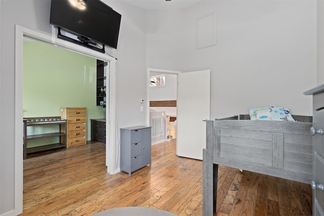 329 N Chipmunk Cir, Silverthorne, CO 80498 - bedroom featuring wood-type flooring and a high ceiling