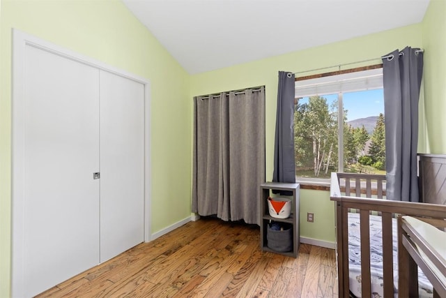 329 N Chipmunk Cir, Silverthorne, CO 80498 - bedroom with lofted ceiling, wood finished floors, and a mountain view