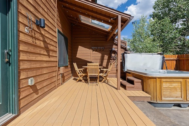 329 N Chipmunk Cir, Silverthorne, CO 80498 - wooden deck featuring a hot tub and outdoor dining area