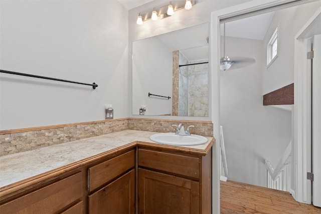 329 N Chipmunk Cir, Silverthorne, CO 80498 - full bath with vanity, a tile shower, and wood finished floors
