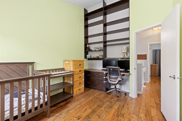 329 N Chipmunk Cir, Silverthorne, CO 80498 - bedroom featuring wood finished floors and built in study area