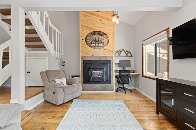 329 N Chipmunk Cir, Silverthorne, CO 80498 - office space with light wood finished floors, vaulted ceiling, and a lit fireplace