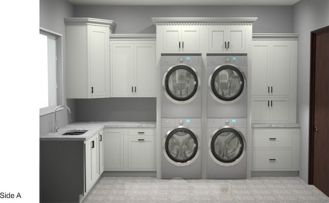 washroom featuring separate washer and dryer, cabinets, sink, and stacked washing maching and dryer