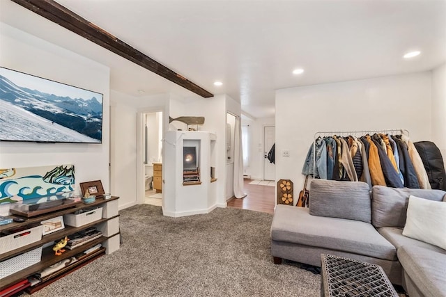 living area featuring beamed ceiling, baseboards, carpet, and recessed lighting
