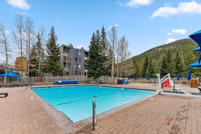 175 Argentine Ct Unit 1513, Keystone, CO 80435 - community pool with a patio area, a mountain view, and fence