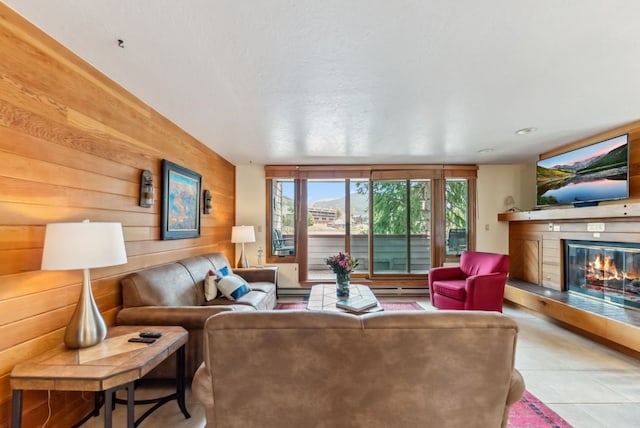 175 Argentine Ct Unit 1513, Keystone, CO 80435 - tiled living area featuring a glass covered fireplace, wooden walls, and baseboard heating