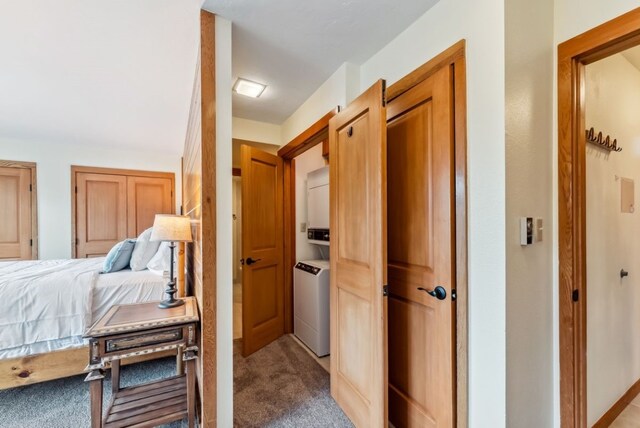 175 Argentine Ct Unit 1513, Keystone, CO 80435 - hall featuring carpet flooring and stacked washer / dryer