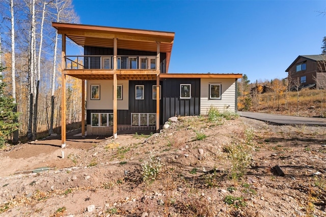 0630 Temple Trl, Frisco, CO 80443 - rear view of house with a balcony and board and batten siding