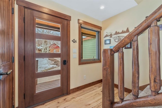 29780 Riffle Run, Oak Creek, CO 80467 - entryway featuring stairs, light wood finished floors, and baseboards
