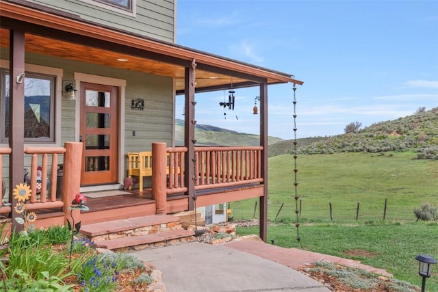 29780 Riffle Run, Oak Creek, CO 80467 - wooden porch with a yard and a mountain view