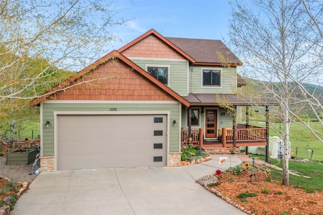 29780 Riffle Run, Oak Creek, CO 80467 - craftsman-style house featuring a porch, concrete driveway, a garage, and roof with shingles