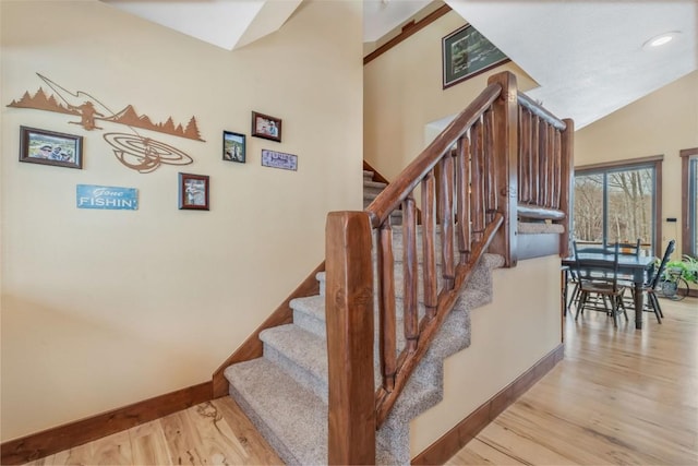 29780 Riffle Run, Oak Creek, CO 80467 - staircase featuring wood finished floors, baseboards, lofted ceiling, and recessed lighting
