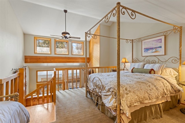 carpeted bedroom with high vaulted ceiling