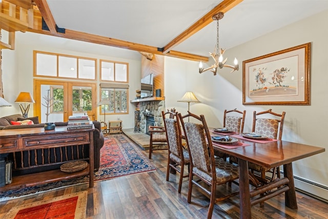 dining room featuring beamed ceiling, wood finished floors, a fireplace, and an inviting chandelier