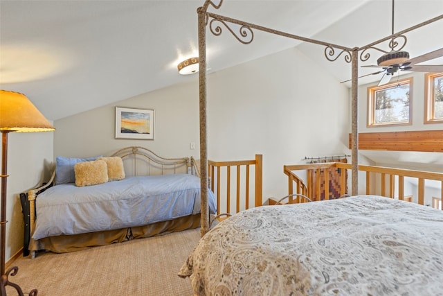 carpeted bedroom with lofted ceiling