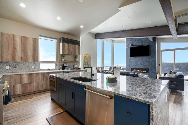 436 N Fuller Placer Rd Unit 38B, Breckenridge, CO 80424 - kitchen with a sink, plenty of natural light, a fireplace, and stainless steel appliances