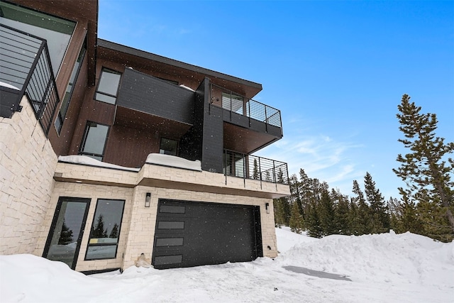 436 N Fuller Placer Rd Unit 38B, Breckenridge, CO 80424 - exterior space with a balcony, stone siding, and a garage