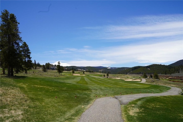 203 Gentian Rd, Keystone, CO 80435 - view of home's community with a mountain view, golf course view, and a lawn