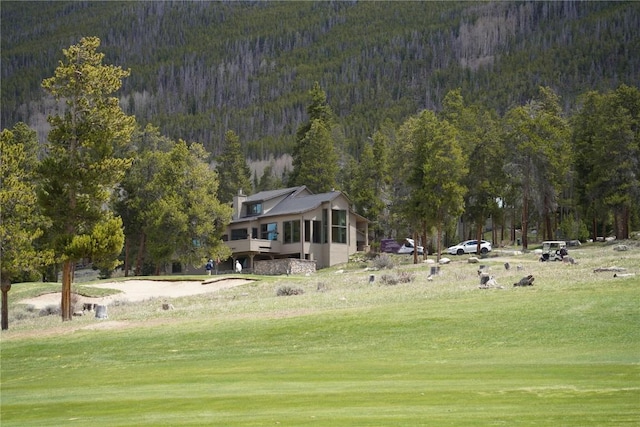 203 Gentian Rd, Keystone, CO 80435 - view of home's community with a view of trees, a lawn, and a mountain view