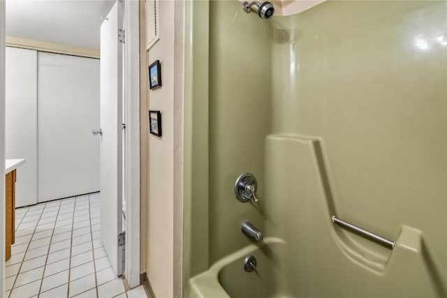 bathroom featuring vanity, tile patterned flooring, and bathing tub / shower combination