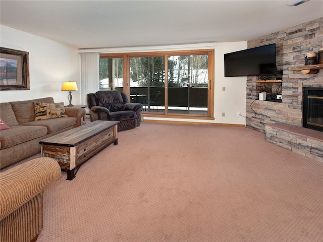 living room with a fireplace, baseboards, and carpet floors
