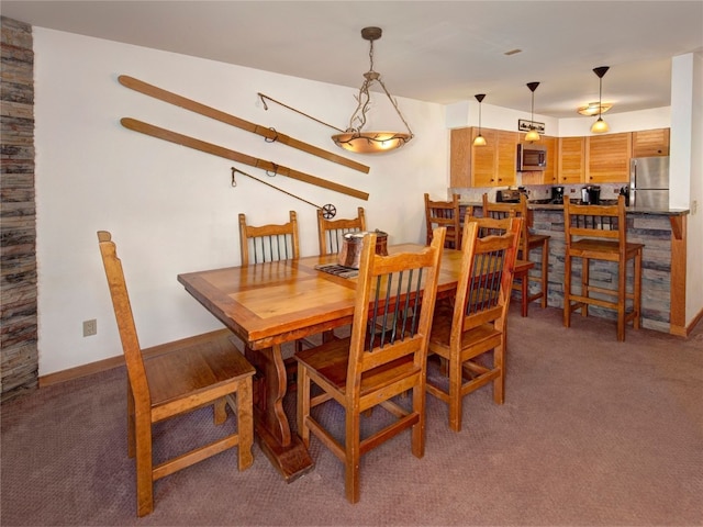 dining room with light colored carpet