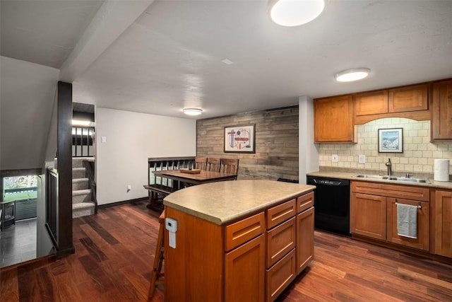 2583 Apres Ski Way Unit 4, Steamboat Springs, CO 80487 - kitchen featuring dishwasher, a sink, brown cabinetry, and dark wood finished floors