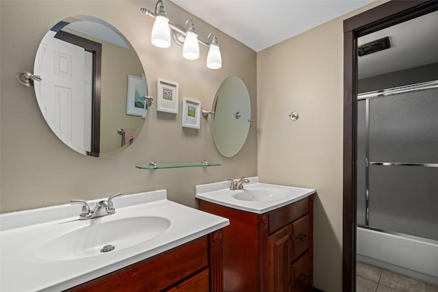 2583 Apres Ski Way Unit 4, Steamboat Springs, CO 80487 - full bath with two vanities, combined bath / shower with glass door, and tile patterned flooring