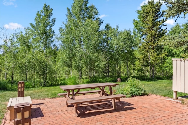 4612 Ryan Gulch Rd Unit 4612, Silverthorne, CO 80498 - view of community with a patio area and a wooded view