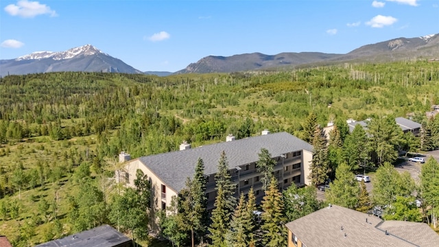 4612 Ryan Gulch Rd Unit 4612, Silverthorne, CO 80498 - aerial view of property and surrounding area with mountains and a heavily wooded area