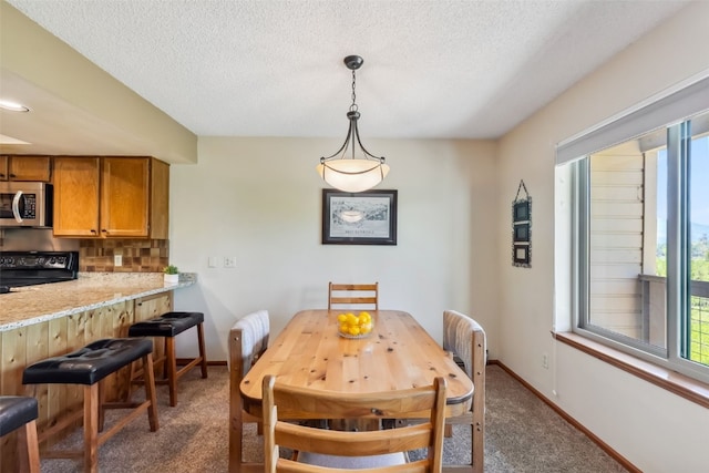 4612 Ryan Gulch Rd Unit 4612, Silverthorne, CO 80498 - carpeted dining room featuring a textured ceiling