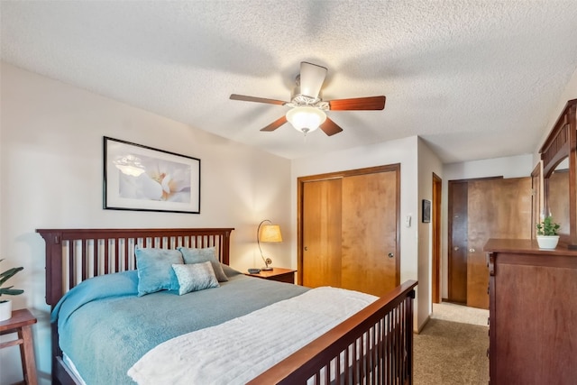 4612 Ryan Gulch Rd Unit 4612, Silverthorne, CO 80498 - bedroom with carpet flooring, a textured ceiling, a closet, and ceiling fan