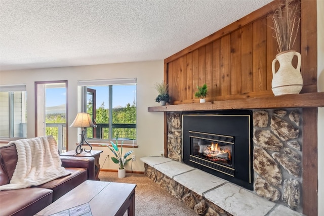 4612 Ryan Gulch Rd Unit 4612, Silverthorne, CO 80498 - living area with carpet floors, a stone fireplace, a textured ceiling, and wooden walls