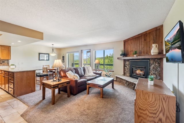 4612 Ryan Gulch Rd Unit 4612, Silverthorne, CO 80498 - living room featuring a fireplace and a textured ceiling