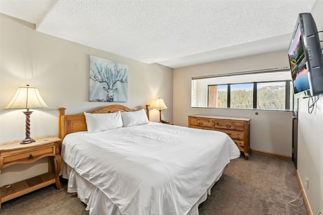631 Village Rd Unit 34330, Breckenridge, CO 80424 - carpeted bedroom with a textured ceiling and baseboards