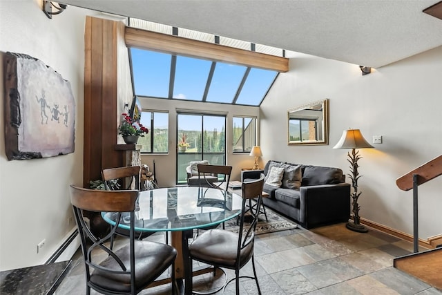 631 Village Rd Unit 34330, Breckenridge, CO 80424 - dining space featuring light stone finish floors and a baseboard radiator