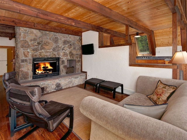 12715 E State Highway 82, Twin Lakes, CO 81251 - living room featuring wood finished floors, wood ceiling with exposed beams, a stone fireplace, and baseboards