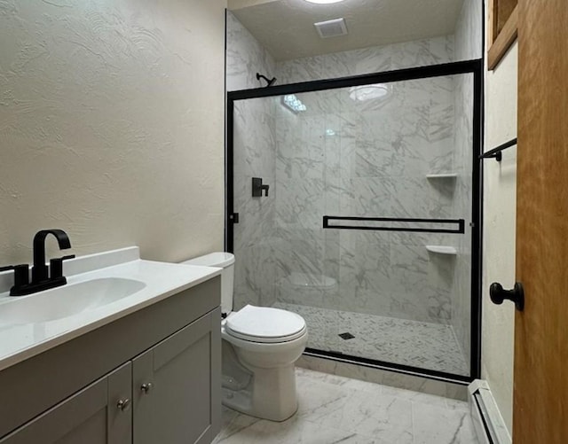 12715 E State Highway 82, Twin Lakes, CO 81251 - full bath with baseboard heating, marble look tiles, vanity, a textured wall, and a marble finish shower