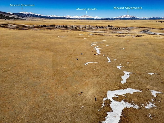 drone / aerial view featuring a mountain view and a rural view