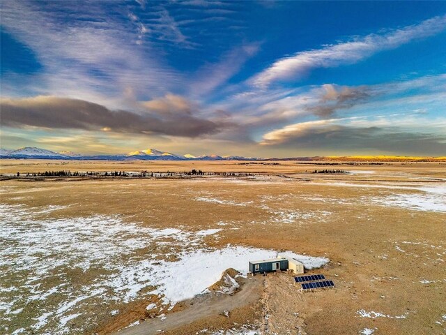 drone / aerial view with a mountain view and a rural view