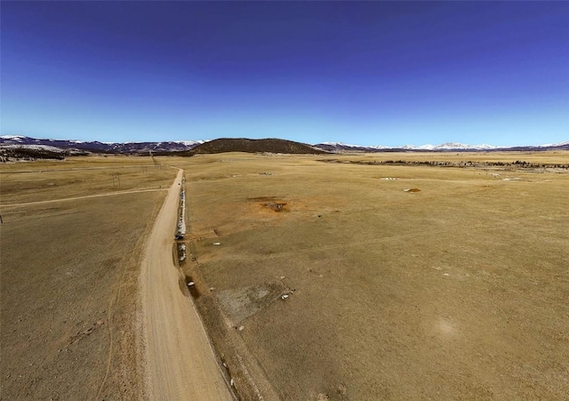 exterior space with a rural view and a mountain view
