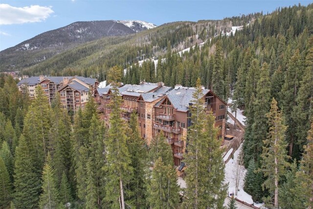 224 Trailhead Dr Unit 3075, Keystone, CO 80435 - birds eye view of property with a wooded view and a mountain view