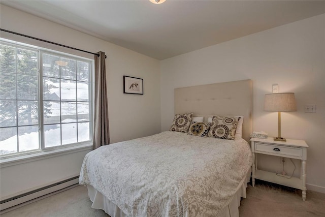 532 Kimmes Ln, Breckenridge, CO 80424 - bedroom featuring a baseboard heating unit, light colored carpet, and multiple windows