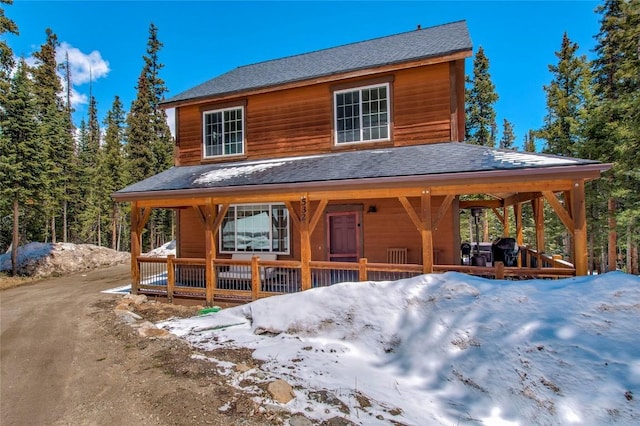 532 Kimmes Ln, Breckenridge, CO 80424 - chalet / cabin with a porch and roof with shingles