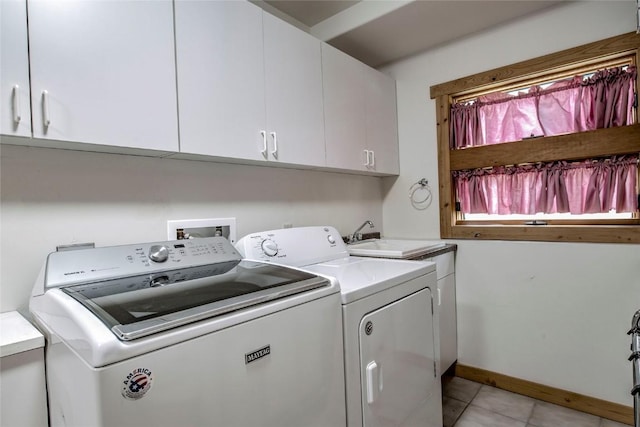196 Vail Cir, Dillon, CO 80435 - laundry area with separate washer and dryer, cabinet space, and light tile patterned floors
