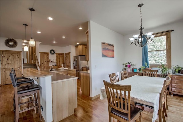 196 Vail Cir, Dillon, CO 80435 - dining space featuring stairway, a chandelier, light wood finished floors, and recessed lighting