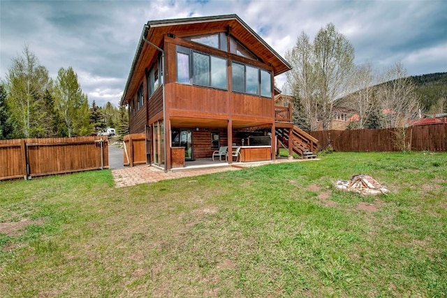 196 Vail Cir, Dillon, CO 80435 - rear view of house featuring a patio, a fenced backyard, stairway, a wooden deck, and a hot tub