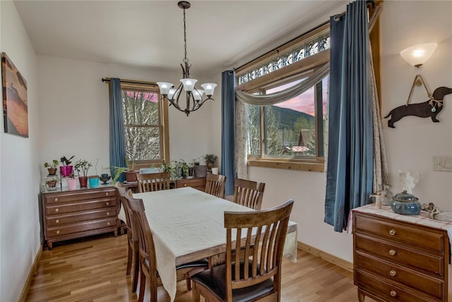 196 Vail Cir, Dillon, CO 80435 - dining area with a chandelier and light wood-style floors