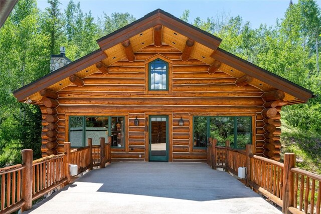 27800 Wapiti Way, Steamboat Springs, CO 80487 - view of front facade with log siding and a chimney